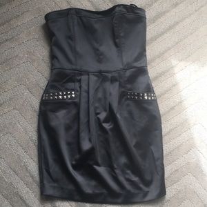Black Strapless dress with grommet pockets.